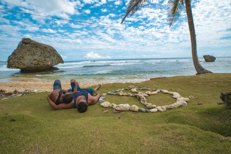 Barbados, mixed race gay couple, multi-ethnic, AA, African American man, lying on beach, embracing, next to peace sign made of rocks, relax, relaxing, fun, large rocks, seaside, seascape, sea, ocean, clouds in background, shore excursion, 

Shoot date: April, 2016