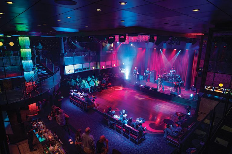 OV, Ovation of the Seas, Music Hall, nightlife, venue, entertainment, wide overhead shot of stage and dance floor, band on stage, musicians playing, guests seated, bar in rear, music