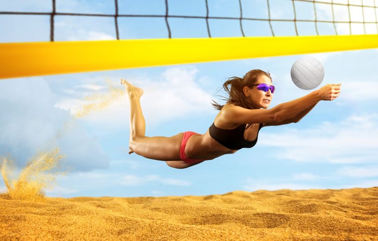 Female volleyball beach  player in action